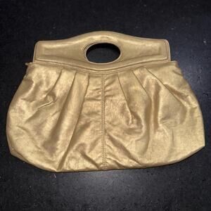 NEW Gold pleated clutch bag with a cutout handle. 16”x12”